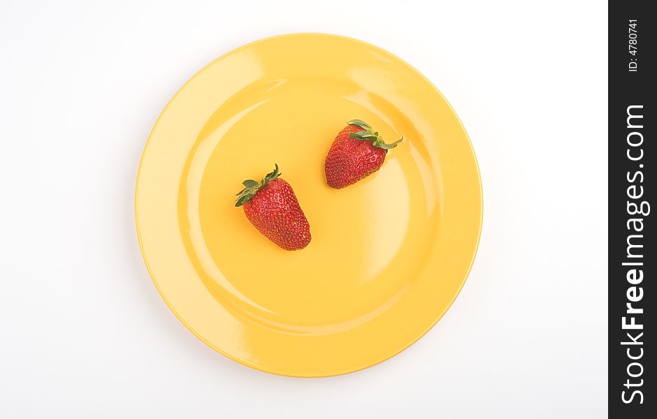 Two strawberry on a plate