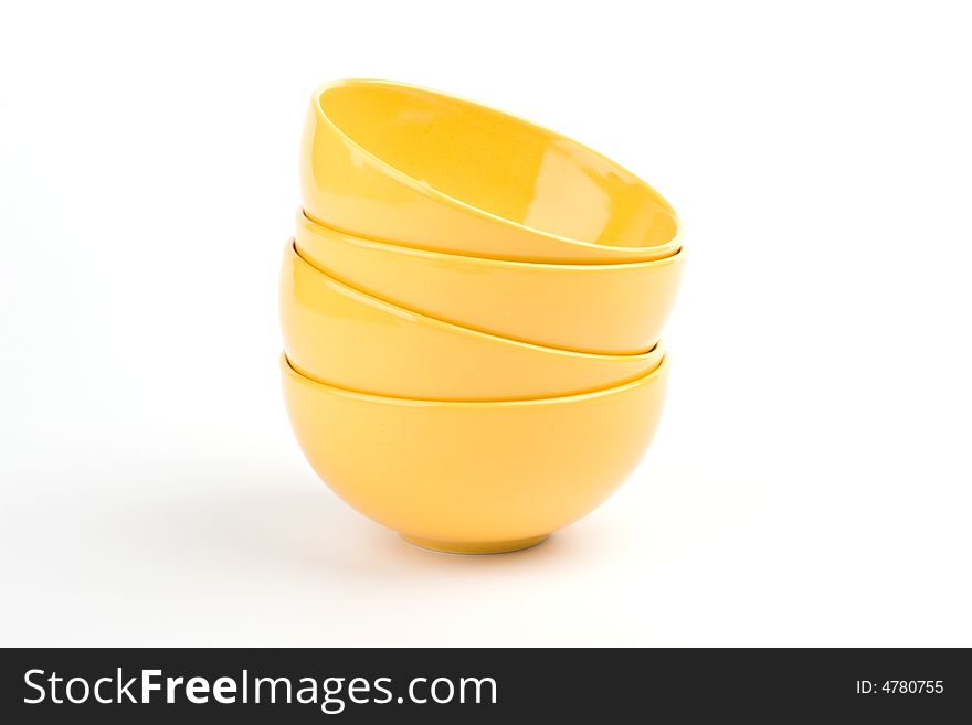 Four ceramic yellow empty bowls