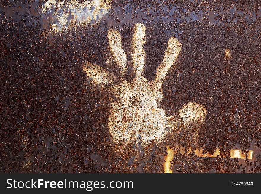 Rusty metal abstract background with handprint. Rusty metal abstract background with handprint