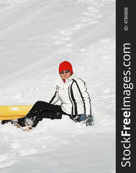 Happy woman plays with snow