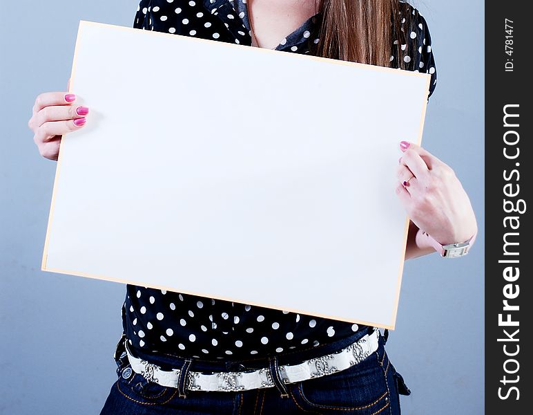 Woman takes in hands empty placard. Woman takes in hands empty placard