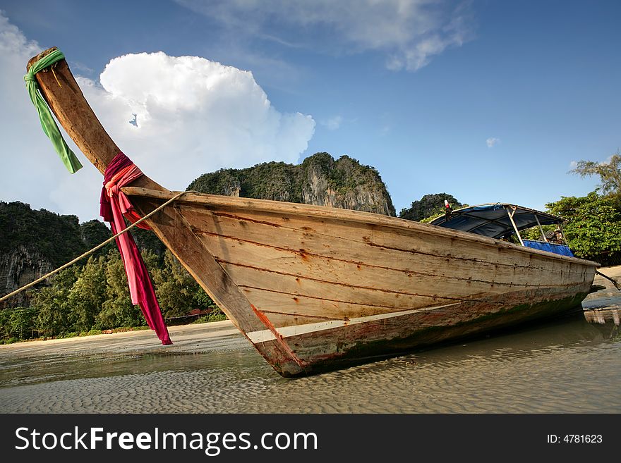 Beautiful longtail boat on the sand seashore. Beautiful longtail boat on the sand seashore
