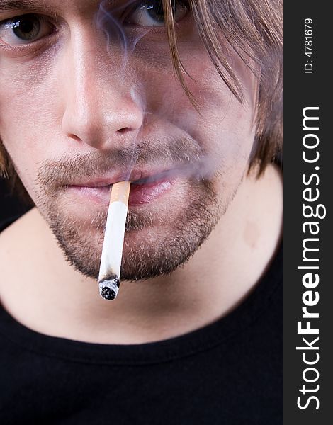 Young Man Smoking Cigarette