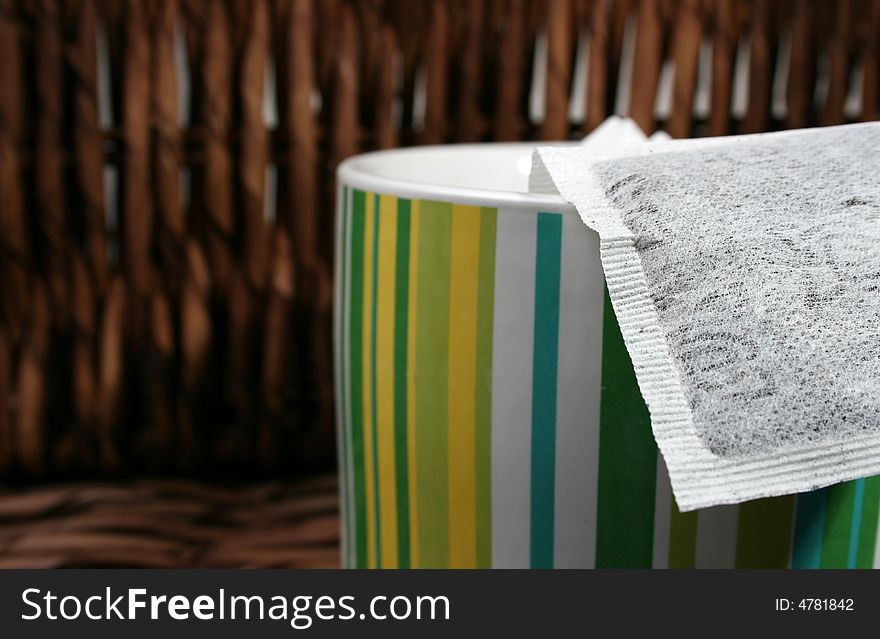 Tea Bags in a green striped ceramic container