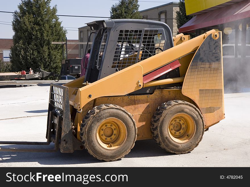 A small lifting machine on a concrete construction job. A small lifting machine on a concrete construction job