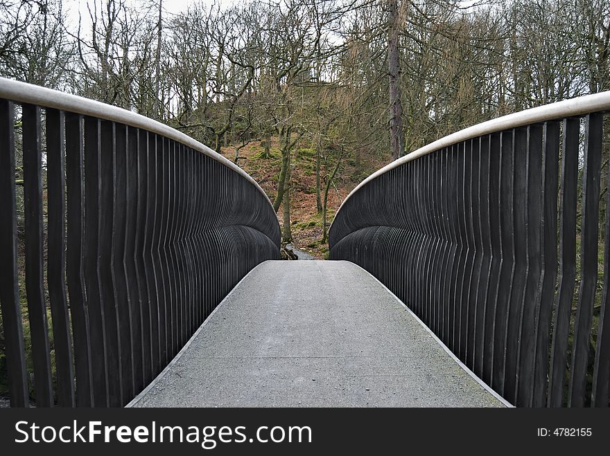 A modern metal footbridge near Skelwith in the English Lake District