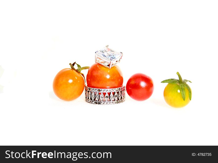 Baby tomatoes with jewels around them. Baby tomatoes with jewels around them.