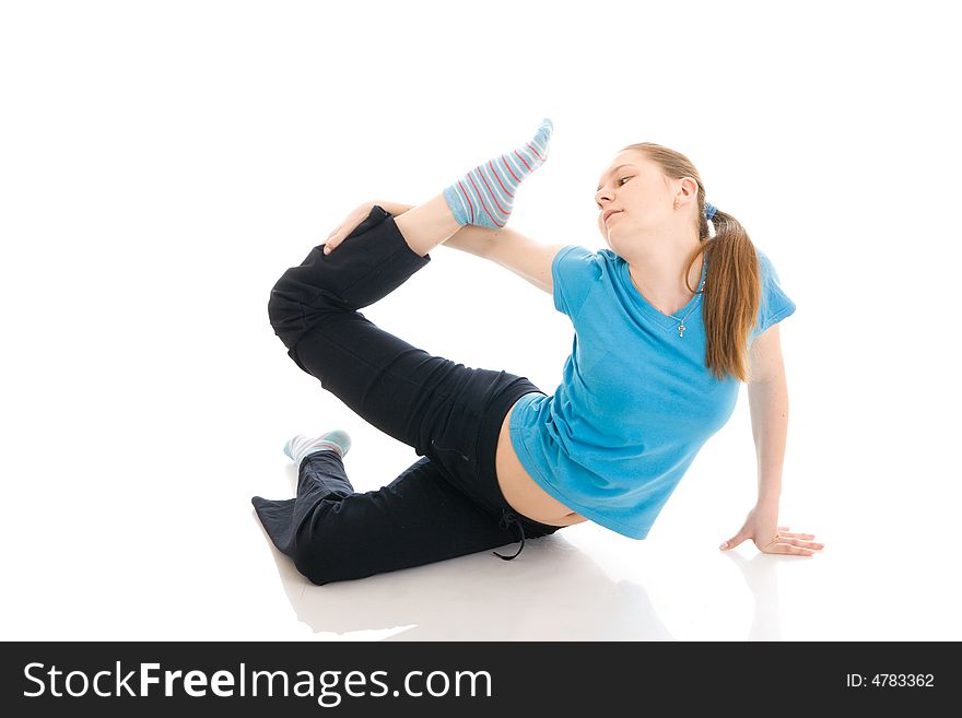 The Young Woman Doing Exercise Isolated On A White
