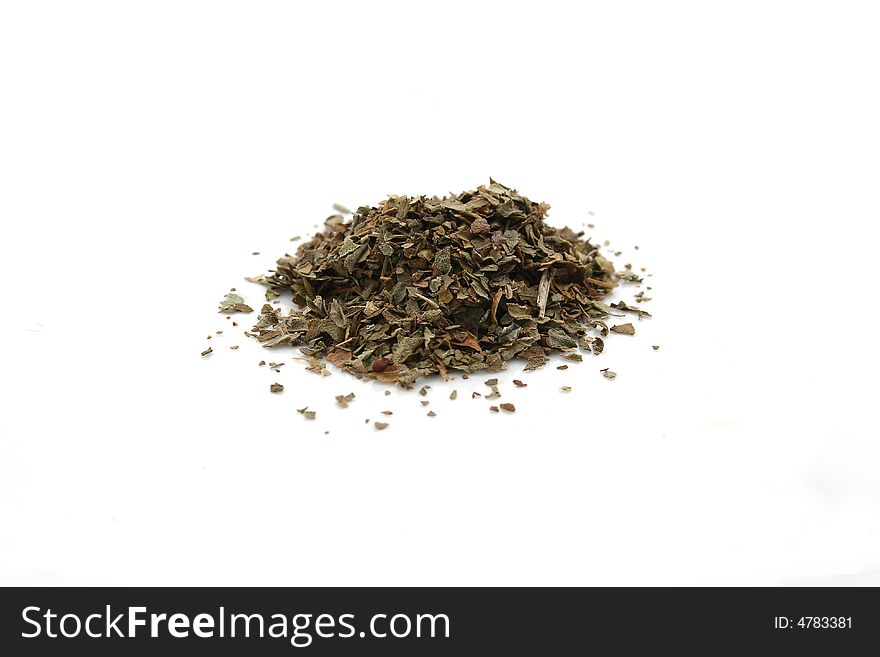 A pile of basil on a white background