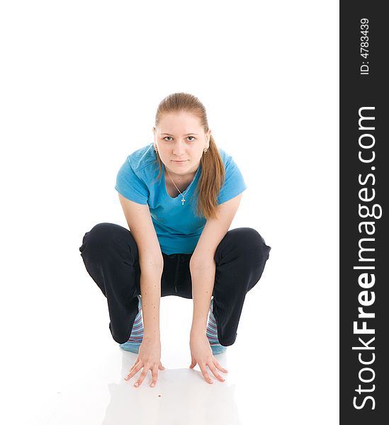 The young woman doing exercise isolated on a white