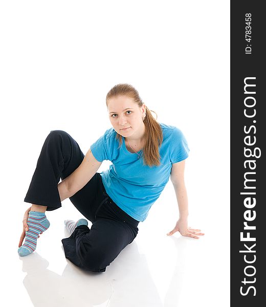 The young woman doing exercise isolated on a white background