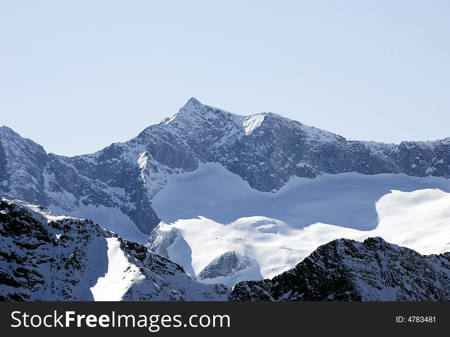 A close up of a white landscape after a snowfall - in blue light - in Italian Alps