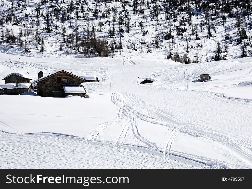 Mountain Huts Under Snow