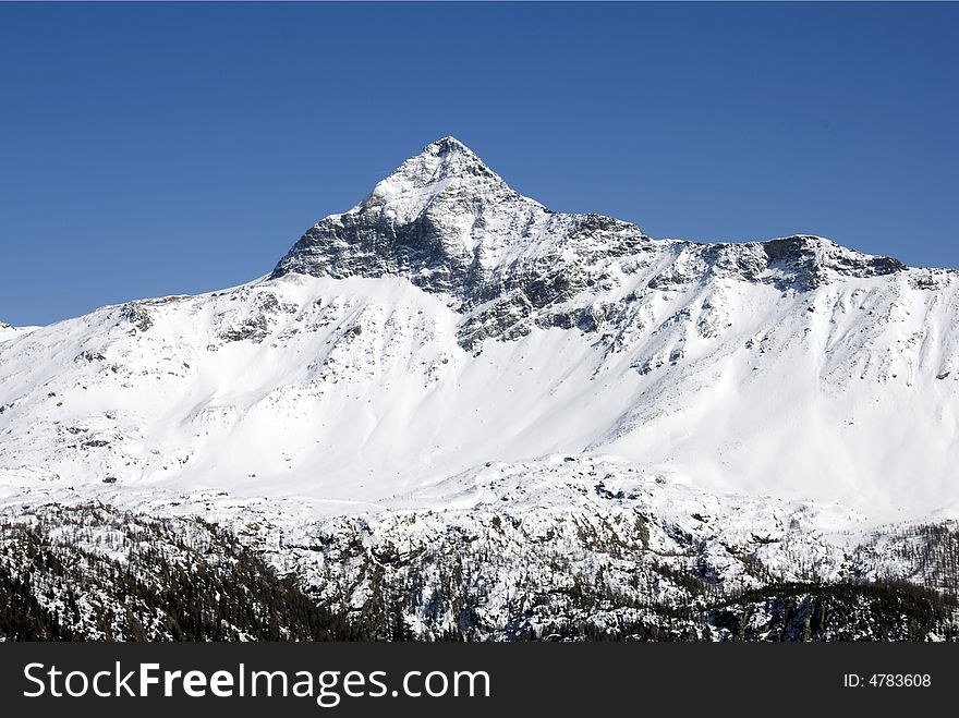 A close up of Pizzo Scalino mountain after a snowfall - Italy. A close up of Pizzo Scalino mountain after a snowfall - Italy