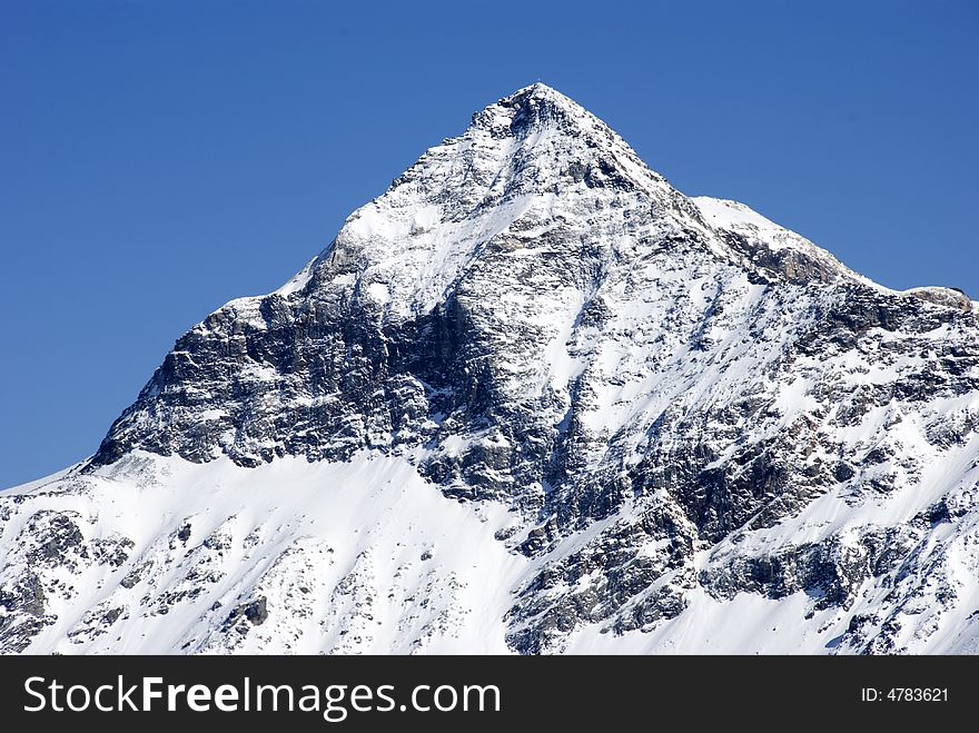 A close up of Pizzo Scalino mountain after a snowfall - Italy