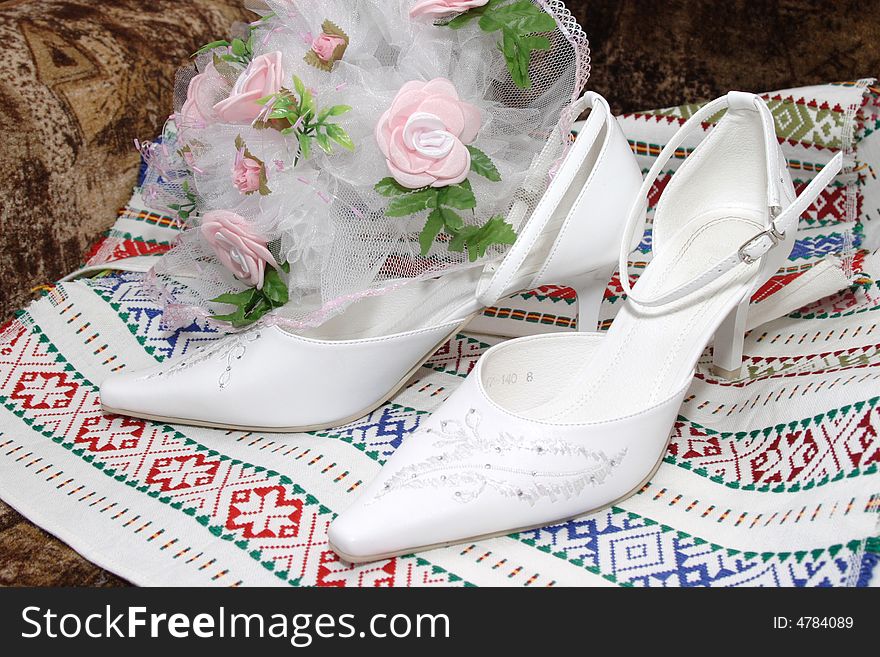 Bride's shoes and bouquet. Bride's shoes and bouquet