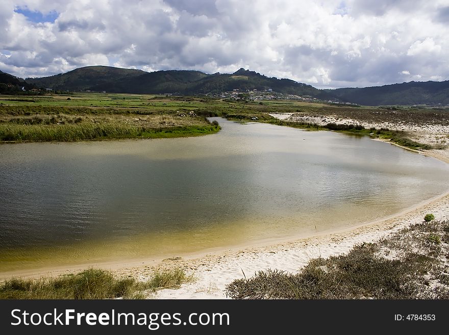 Lake near a beach with aquamarine water. Lake near a beach with aquamarine water