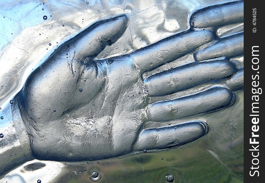 Print of a hand in glass close up. Print of a hand in glass close up