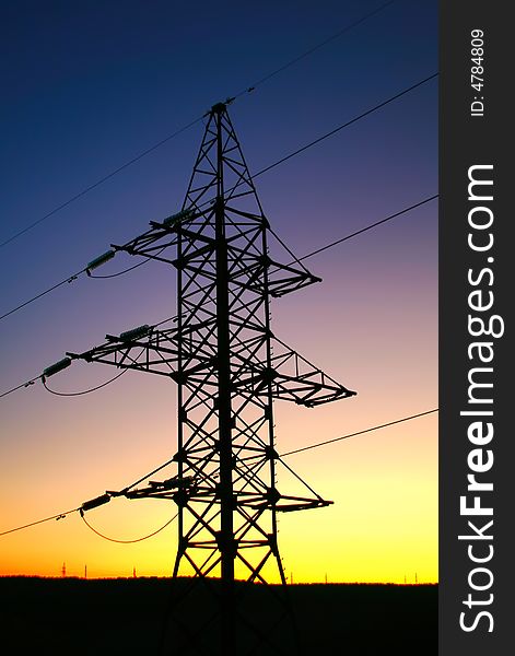 Silhouette of a column electric transfers on a background of a decline