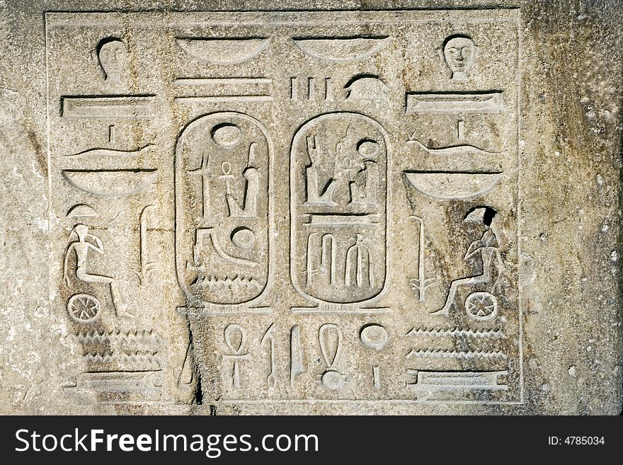 Egyptian symbols and texts carved in stone. Egyptian symbols and texts carved in stone