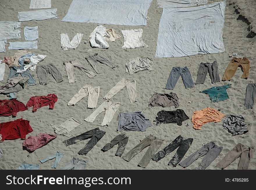Clothes drying on sand