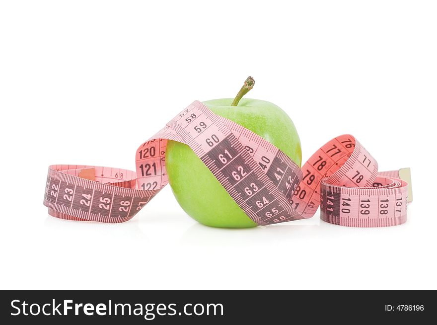 Green apple and tape measure isolated on a white background