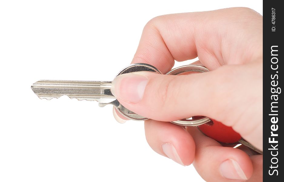 Hand holding a keys on a white background