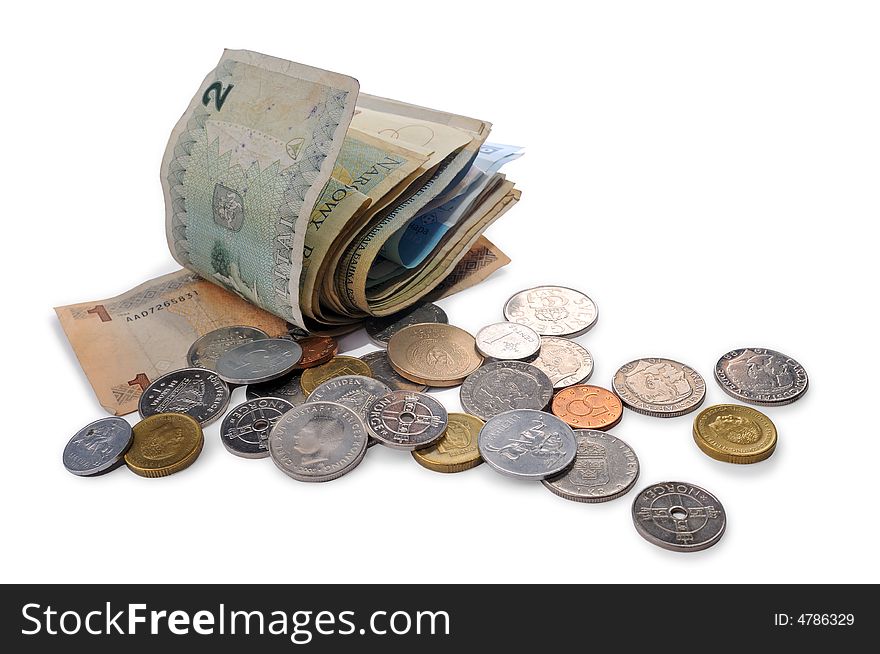 Banknotes and coins spread randomly on a table.