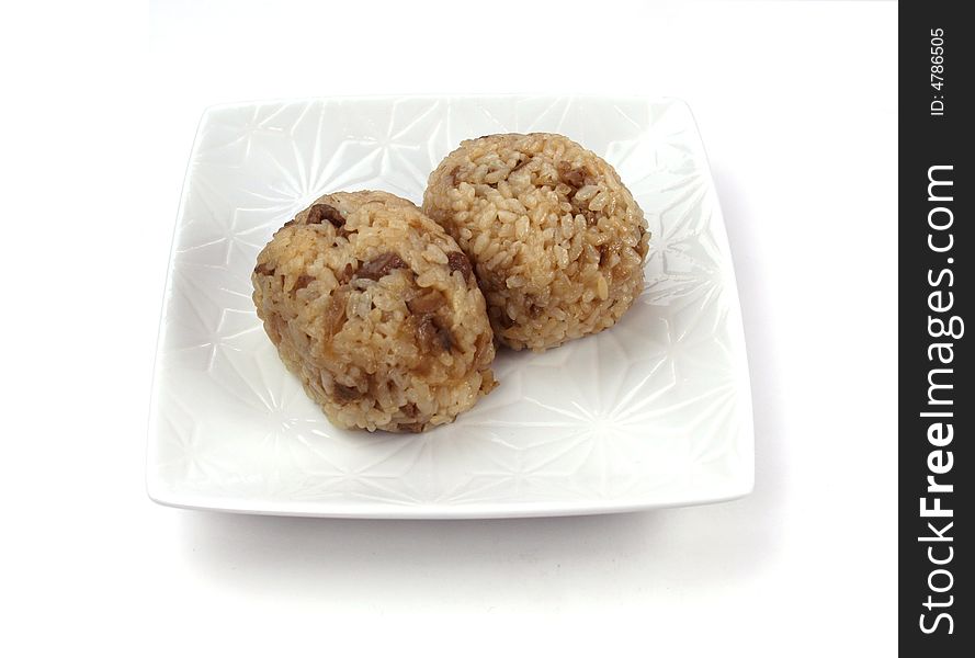 Two rice ball on the white dish