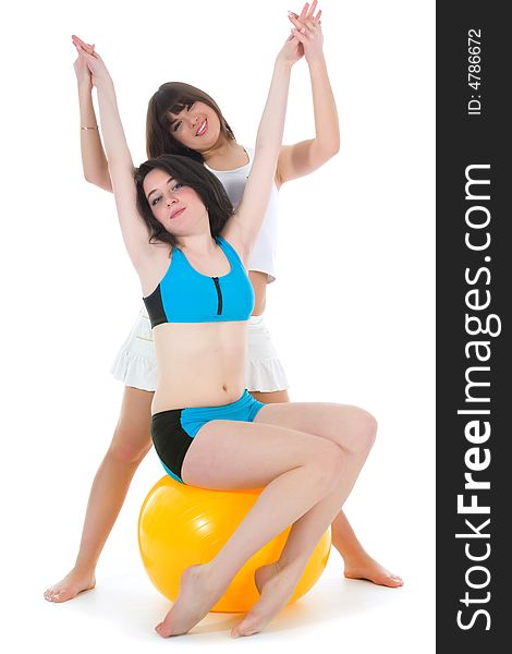 Girls practicing fitness  on  white  background