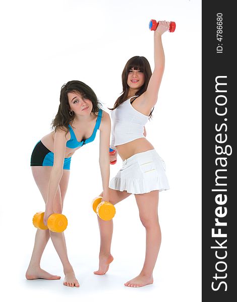 Girls practicing fitness  on  white  background