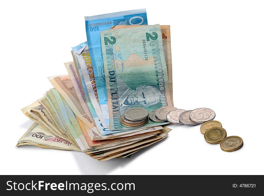 Banknotes and coins spread randomly on a table.