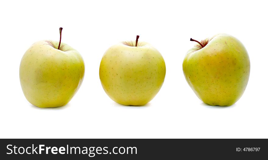 Three yellow apple on a white background. Three yellow apple on a white background