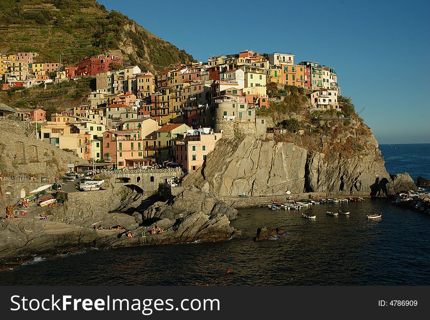 Village of Manarola, Cinque Terre, Italy. Coastal terrace houses and port