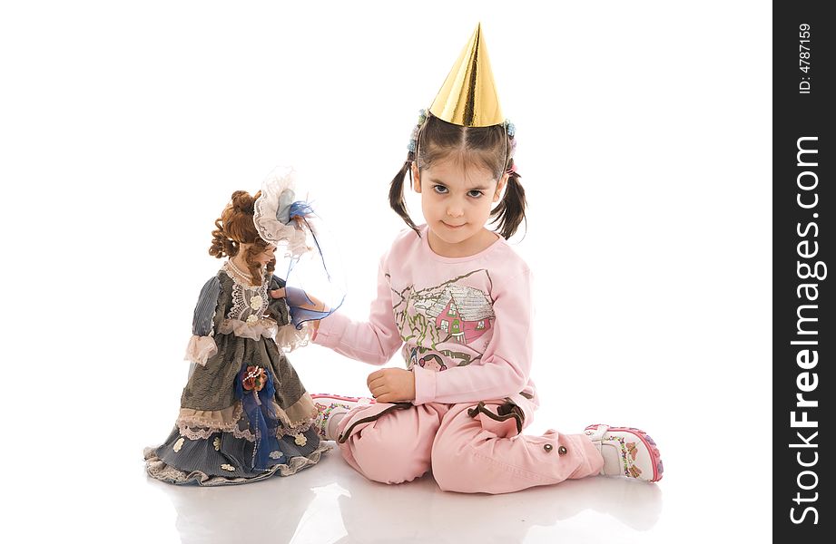 The little girl with a doll isolated on a white background