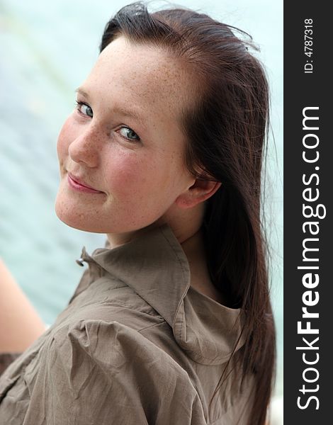 Portrait of a beautiful young woman smiling.