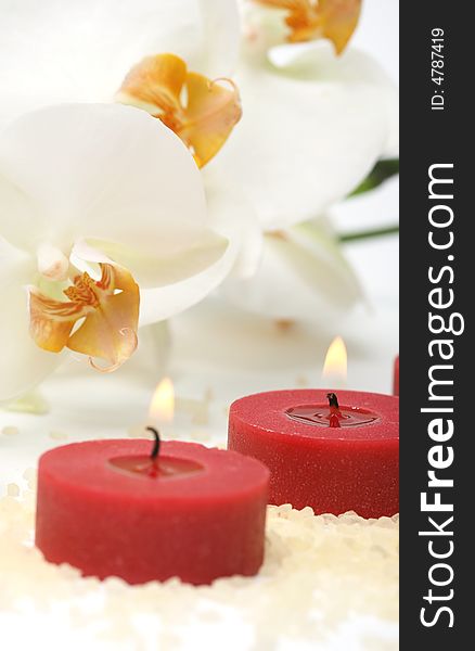 Aromatherapy red candles and white orchid