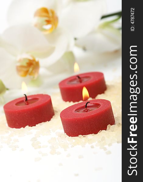 Aromatherapy red candles and white orchid