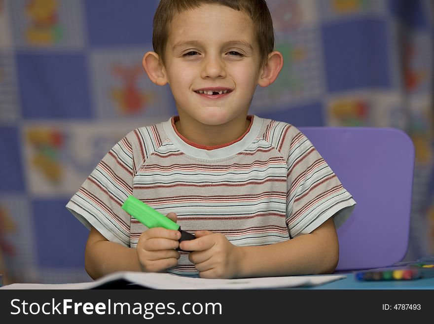 Boy with felt-tip in the right hand