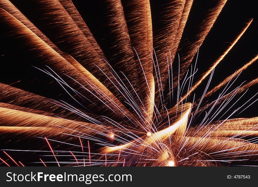 Red,yellow and orange fireworks in a dark background