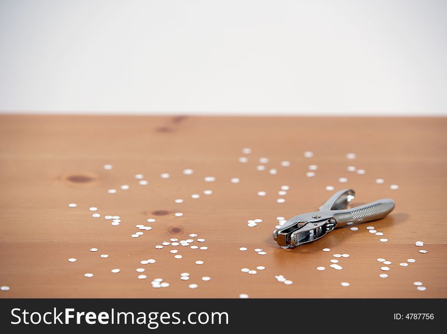 A hole punch on a desk in the office