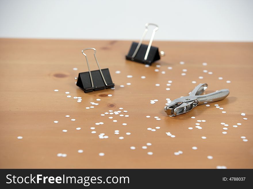 A hole punch on a desk in the office