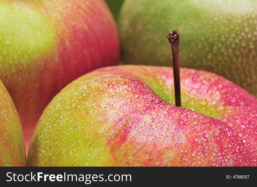 Close-up of red delicious apples with drops