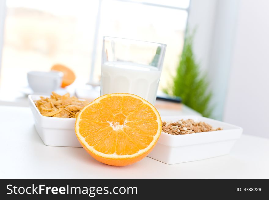 Delicious breakfast / cornflakes, milk and orange. Delicious breakfast / cornflakes, milk and orange