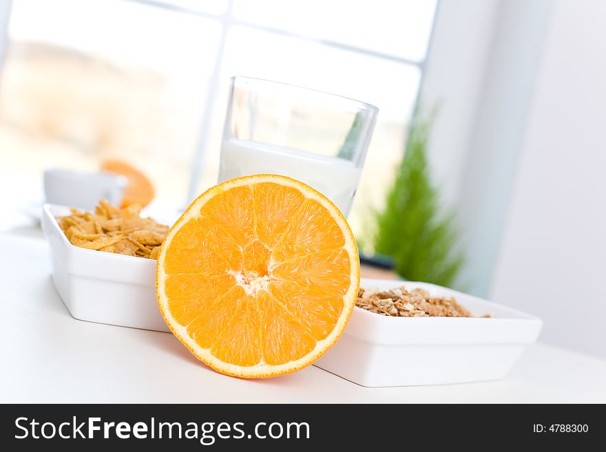 Orange, cornflakes and milk /Fast and delicious breakfast. Orange, cornflakes and milk /Fast and delicious breakfast