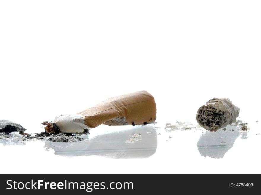 Cigarette butt with ash on white background