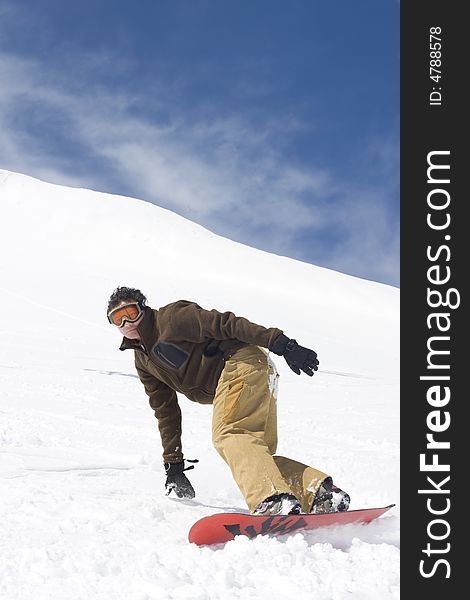 Snowboarder boarding in fresh snow