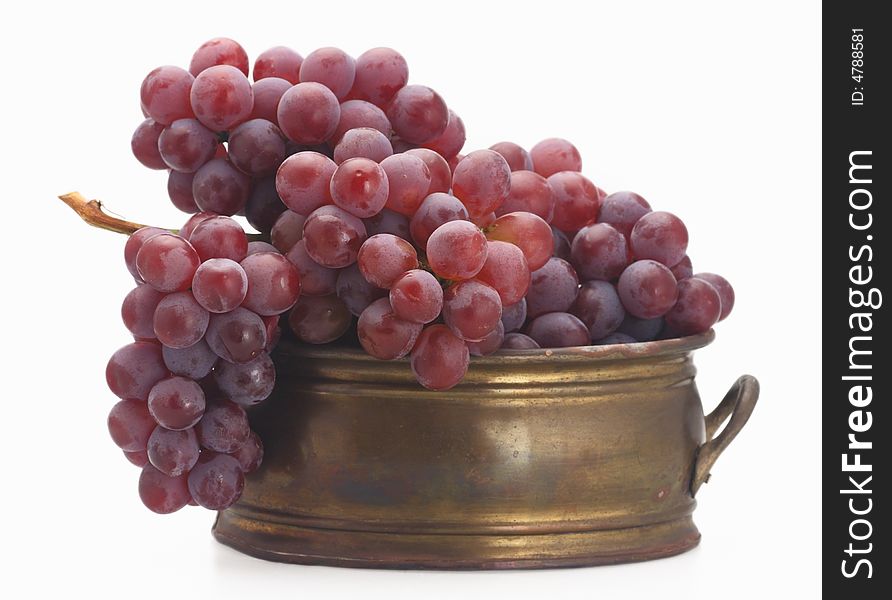 Fresh red grape old  brassy tub isolated. Fresh red grape old  brassy tub isolated