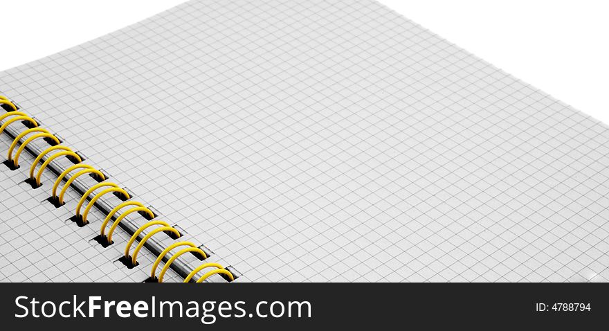 Close up of a spiral bound notebook with yellow spirals