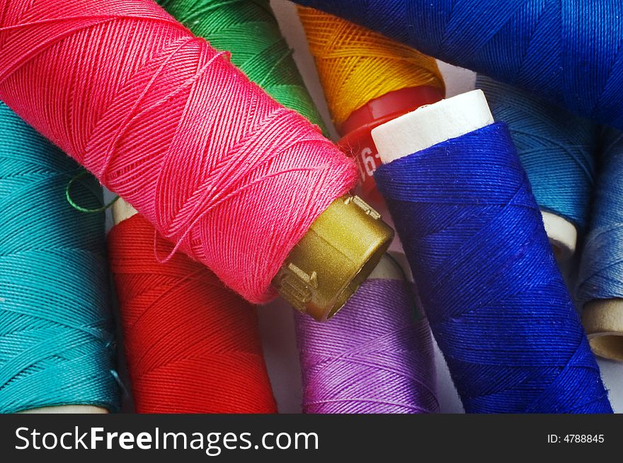 Close up of colored thread spools. Close up of colored thread spools